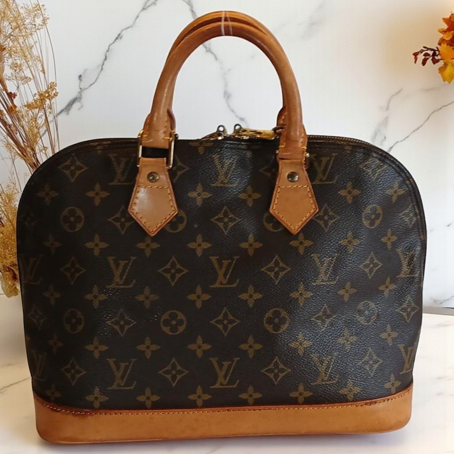 Louis Vuitton Alma PM Monogram Handbag - Vintage Authentic